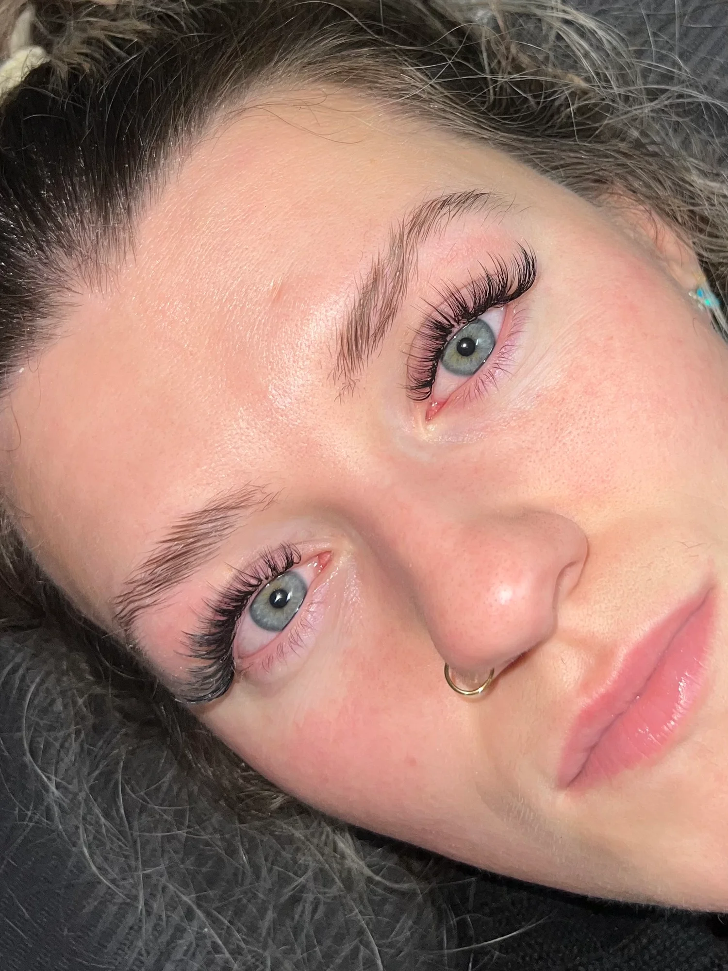 Finished lash extensions framing a client's eyes